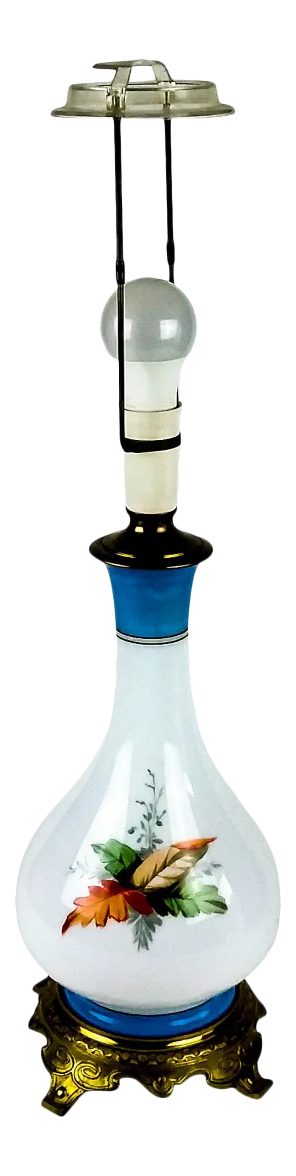 Victorian Hand Painted Glass Table Lamp: Very Rare hand blown glass lamp has been hand painted with a blonde cherub among palm leaves. This type of lamp with this quality is quite difficult to find, hence the price. The base is solid carved