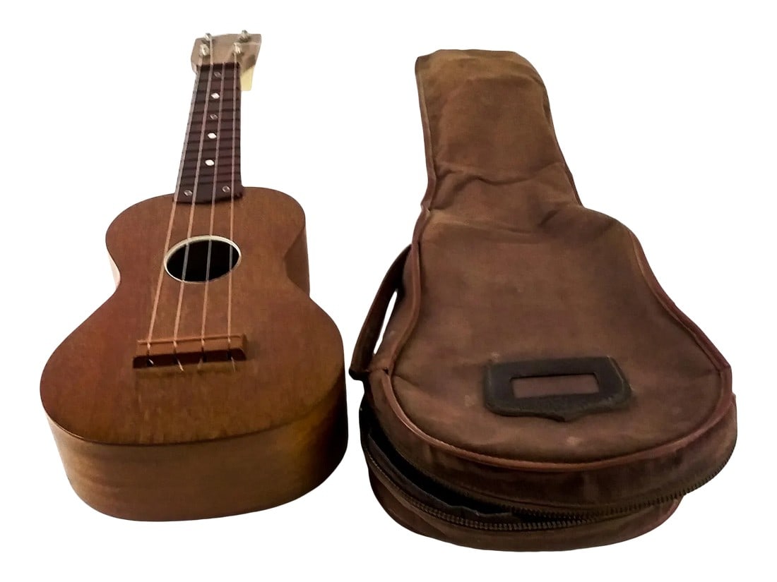 Vintage Hand Crafted Mahogany Ukulele by Roy Smeck: This is a Roy Smeck ukulele made by Harmony. It is solid Mahogany, top, back, sides, and neck. This ukulele has a molded plastic fretboard. Remarkably, there is an ivrory binding around the soundhole.