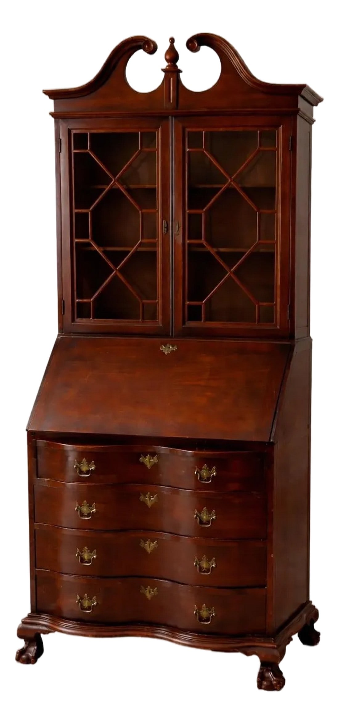 1930s–1940s Northwestern Furniture Co. Mahogany Serpentine Secretary Bookcase Desk: A refined 1930s–1940s American Colonial Revival secretary bookcase by Northwestern Furniture Co. of Burlington, Iowa. Featuring a dramatic broken pediment, glass-paneled upper cabinet, fully
