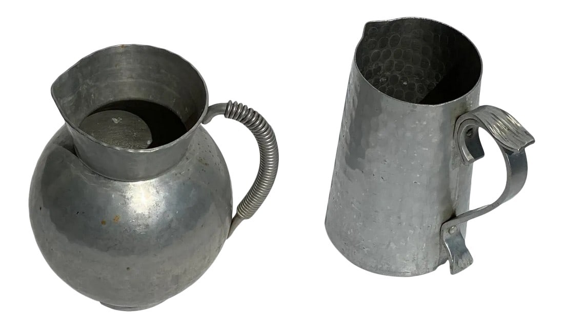1930s Vintage Bw Buenlium Hammered Aluminum Pitchers - 2 Pieces: Vintage Hammered Buenilum Pitchers. Buenilum Aluminum company was founded by Frederick Buehner and his business partner Franz Wanner. Buehner emigrated from Germany to the U.S in 1929 He developed