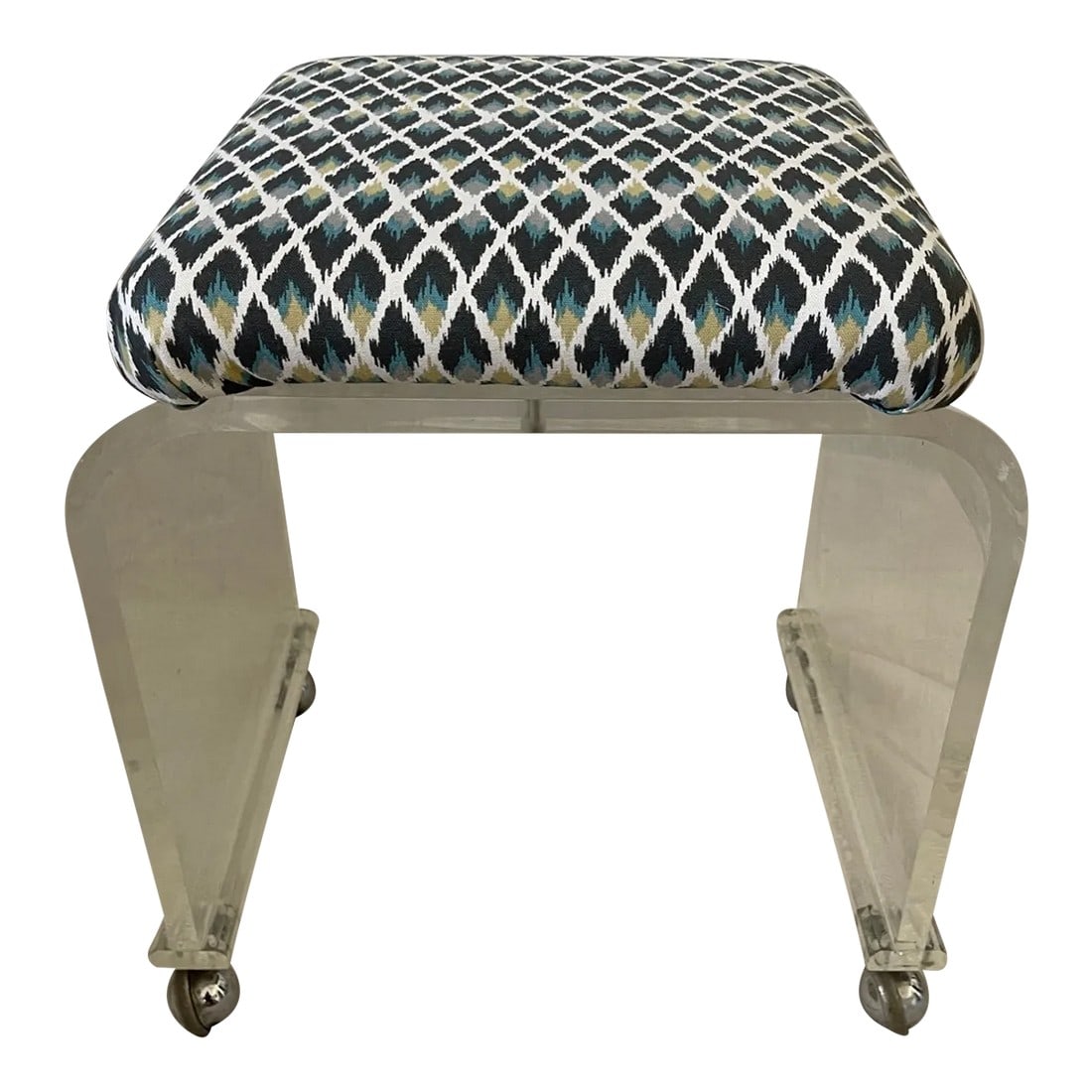 Mid-Century Lucite Upholstered Waterfall Stool/Bench: Lucite Upholstered Stool Bench with a curved waterfall frame. Newley reupholstered in a bright Mid Century print. Teal, gray, cream and soft yellow. Clear acrylic base on casters. 20in h x 19.5in w x