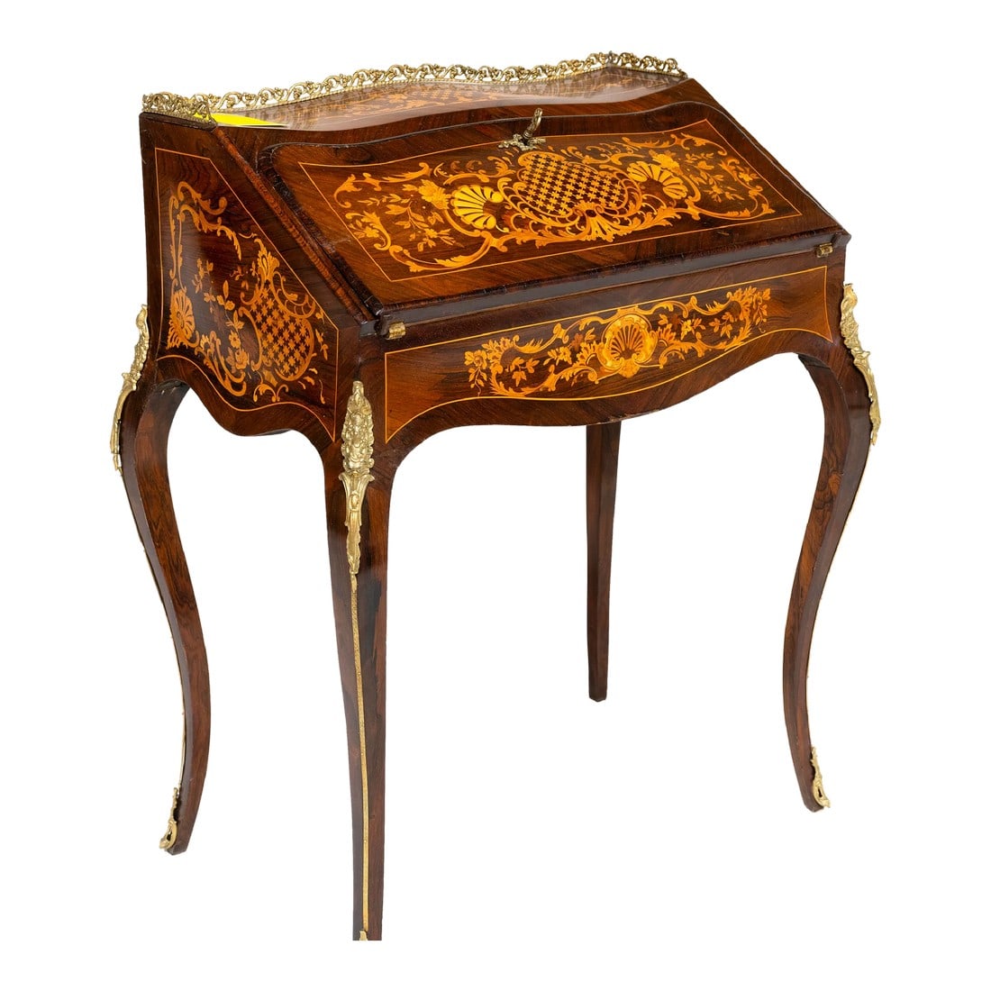 18th Century Louis XV Period Marquetry Desk: This gorgeously curved Louis XV period secretary desk features beautifully intricate marquetry work, elegant bronze moldings, mounts and gallery. The locking drop reveals the original leather writing
