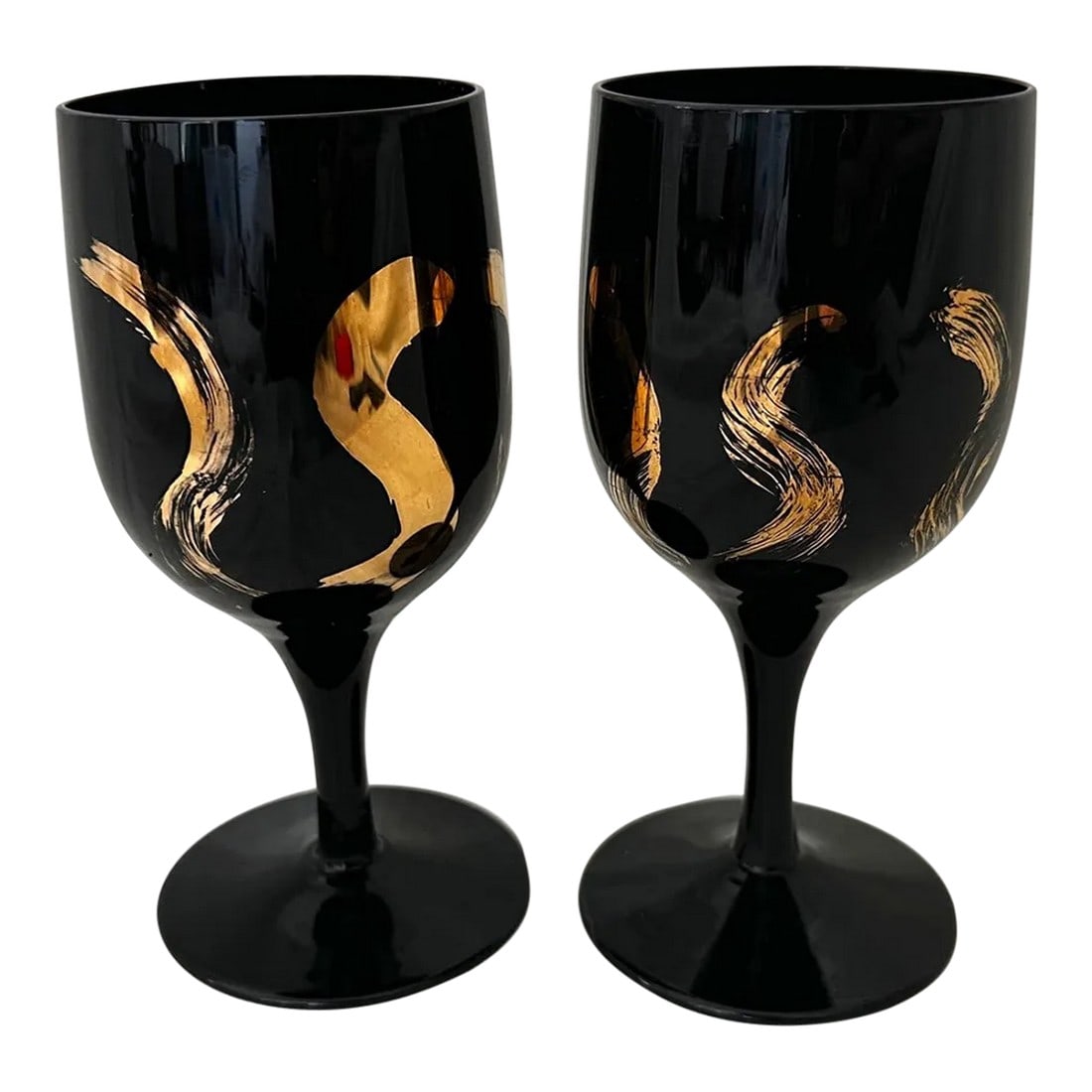 Black & Gold Pair of 2 Wine Glasses: Vintage pair of Black and Gold Wine Glasses. Perfect for mixing with other black glasses. Dark black with gold s swishes. 6in h x 2.5in Condition: Alterations: Original Condition Unaltered Imperfectio