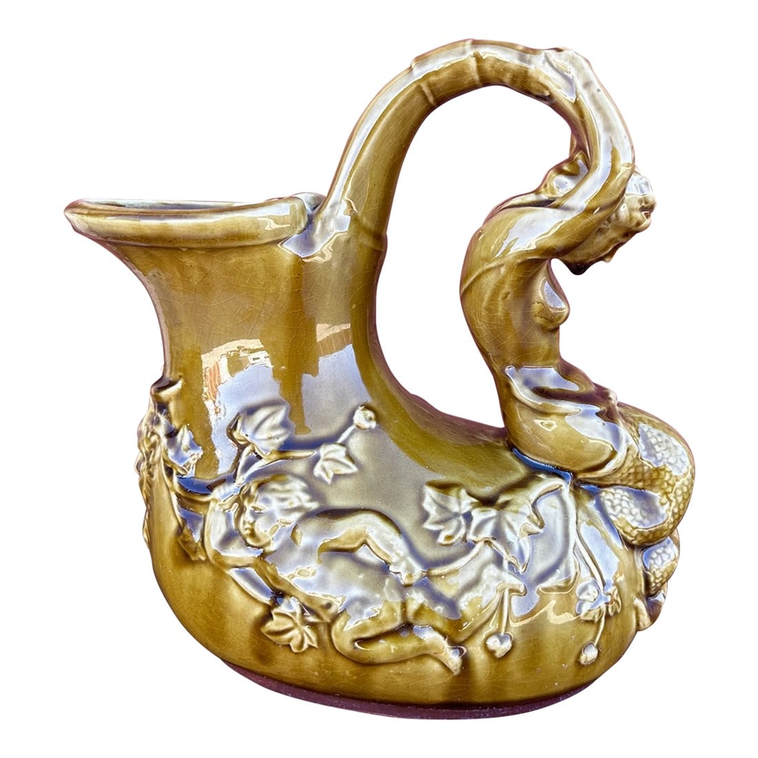 Shi Wan Ware Chinese Ceramic Pitcher: SHI WAN WARE Chinese Ceramic Pottery Amber Mermaid handle decorative pitcher. Very unique piece. Shi Wan Wares are individually handcrafted using traditional techniques. Slight irregularities in