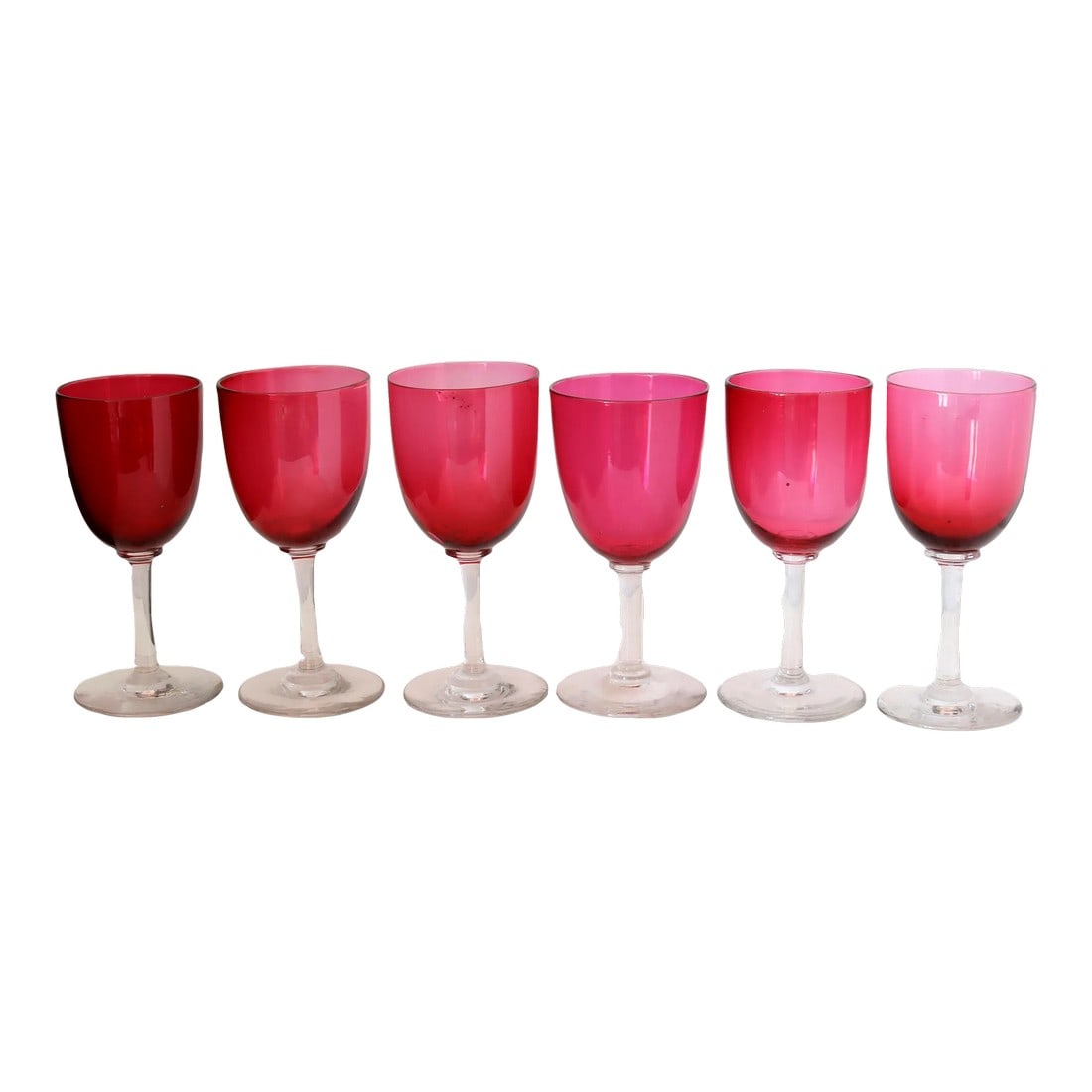19th-Century English Victorian Hand-Blown Cranberry Wine / Cocktail Stems: If Lady Whistledown hosted a cocktail party, these would be on the tray. A radiant set of six Victorian cranberry glass goblets with hand-blown clarity and a dash of drama, each holds about
