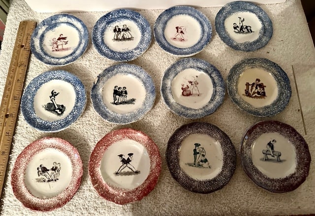 12 Small 19th C. Spatterware Child’s Plates: 12 small (3 ¼” – 3 ½” diameter) Kids’ Activity plates with Spatterware (blue, red and purple) rims. Each plate has a different transfer image of a child or children