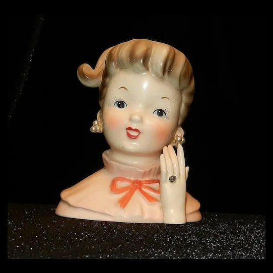 Vintage 1950's Napcoware C5037 Teen Girl Figurine: This is a charming Vintage 1950's Napcoware C5037 Teen Girl Figurine. She is dressed in a lovely pink dress with a white apron and is holding a bouquet of flowers. The figurine is made of porcelain