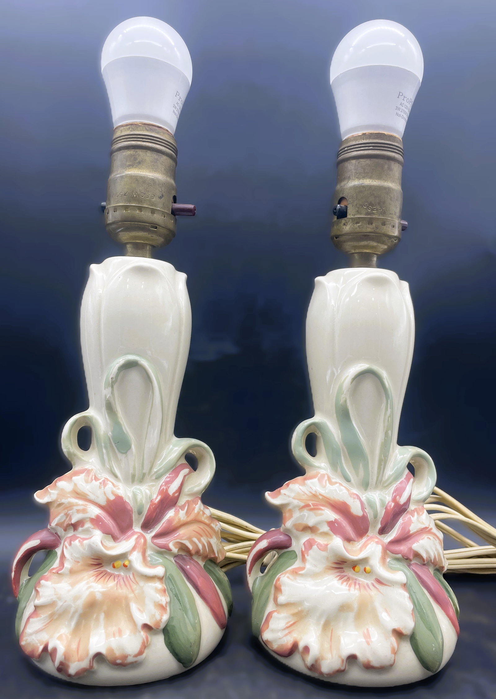 Pair of Vintage WILLIAM F.B. JOHNSON ORCHID Hand Painted Vanity /Dresser Lamps: Date/Period: approx. 1940's Dimension: approx 10 x 4 Material: CERAMIC Additional Information: Pair of Vintage WILLIAM F.B. JOHNSON ORCHID VANITY DESK Lamp Shipping: Domestic: Flat-rate of $25.00 