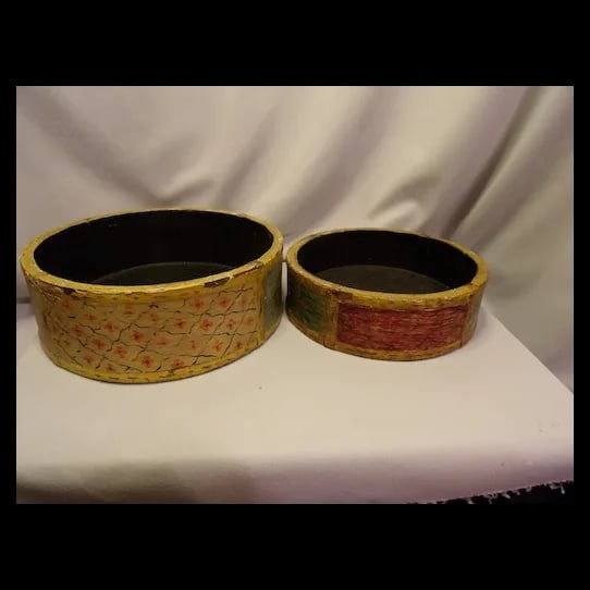 Vintage Pair Folk Art Handmade Wood Sculptures: This is a unique pair of Vintage Folk Art Handmade Wood Sculptures. These carvings depict stylized human figures with elongated forms and expressive features. They are carved from a single piece of