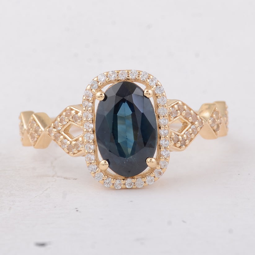 1.84 Ct Oval Sapphire 9K Gold Ring: 1.84 Total Carat Sapphire 9K Gold Ring Specifications: Total Weight 2.15 g Center Gemstone Sapphire Gemstone Carat Weight 1.57 Carats Gemstone Measurements 9.20X6X3.30 mm Additional Gemstones White