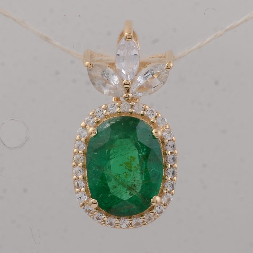 1.95 Ct Oval Emerald 9K Gold Pendant: 1.95 Total Carat Emerald 9K Gold Pendant Specifications: Total Weight 1.17 g Center Gemstone Emerald Gemstone Carat Weight 1.52 Carats Gemstone Measurements 8.20X6.30X4.10 mm Additional Gemstones