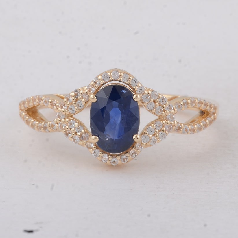 1.56 Ct Oval Sapphire 9K Gold Ring: 1.56 Total Carat Sapphire 9K Gold Ring Specifications: Total Weight 2.24 g Center Gemstone Sapphire Gemstone Carat Weight 1.28 Carats Gemstone Measurements 7X5.10X3.80 mm Additional Gemstones White