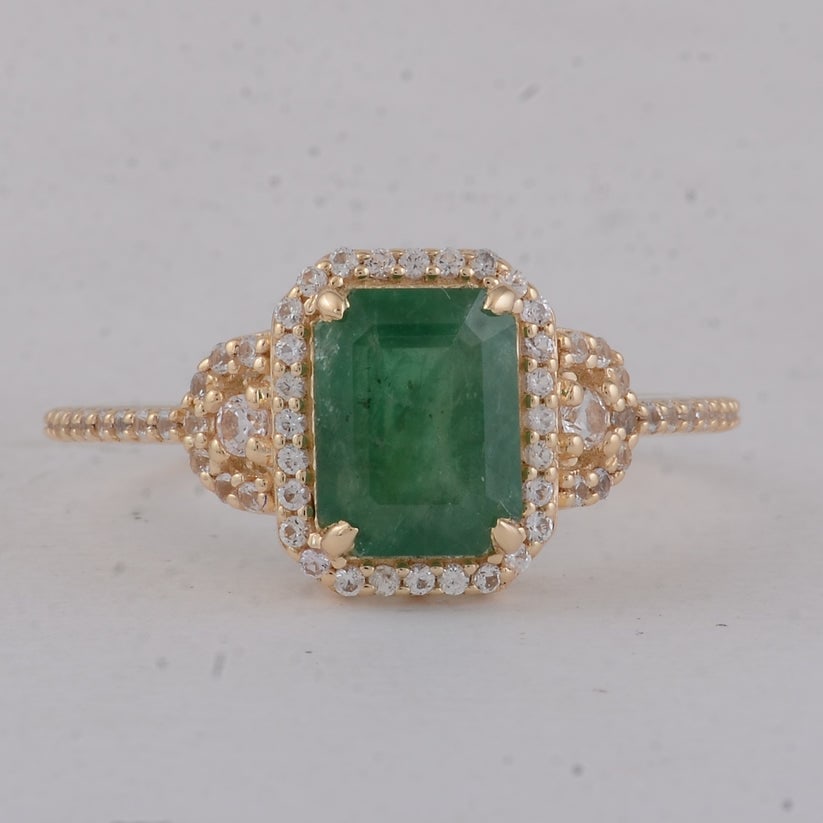1.89 Ct Octagon Emerald 9K Gold Ring: 1.89 Total Carat Emerald 9K Gold Ring Specifications: Total Weight 2.19 g Center Gemstone Emerald Gemstone Carat Weight 1.57 Carats Gemstone Measurements 8X6 mm Additional Gemstones White Sapphire