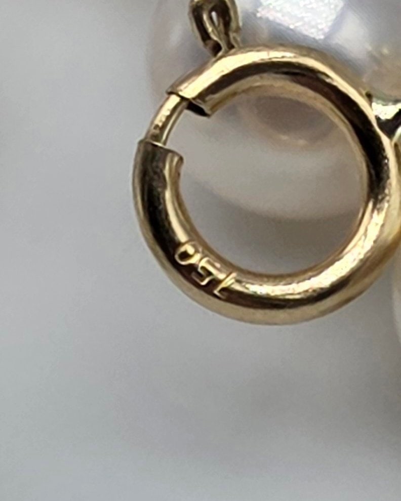 Akoya pearl necklace, 6.2 to 6.4 mm, with natural sapphire spacers, a central oval sapphire with - 3