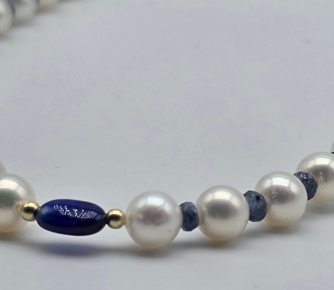 Akoya pearl necklace, 6.2 to 6.4 mm, with natural sapphire spacers, a central oval sapphire with - 4