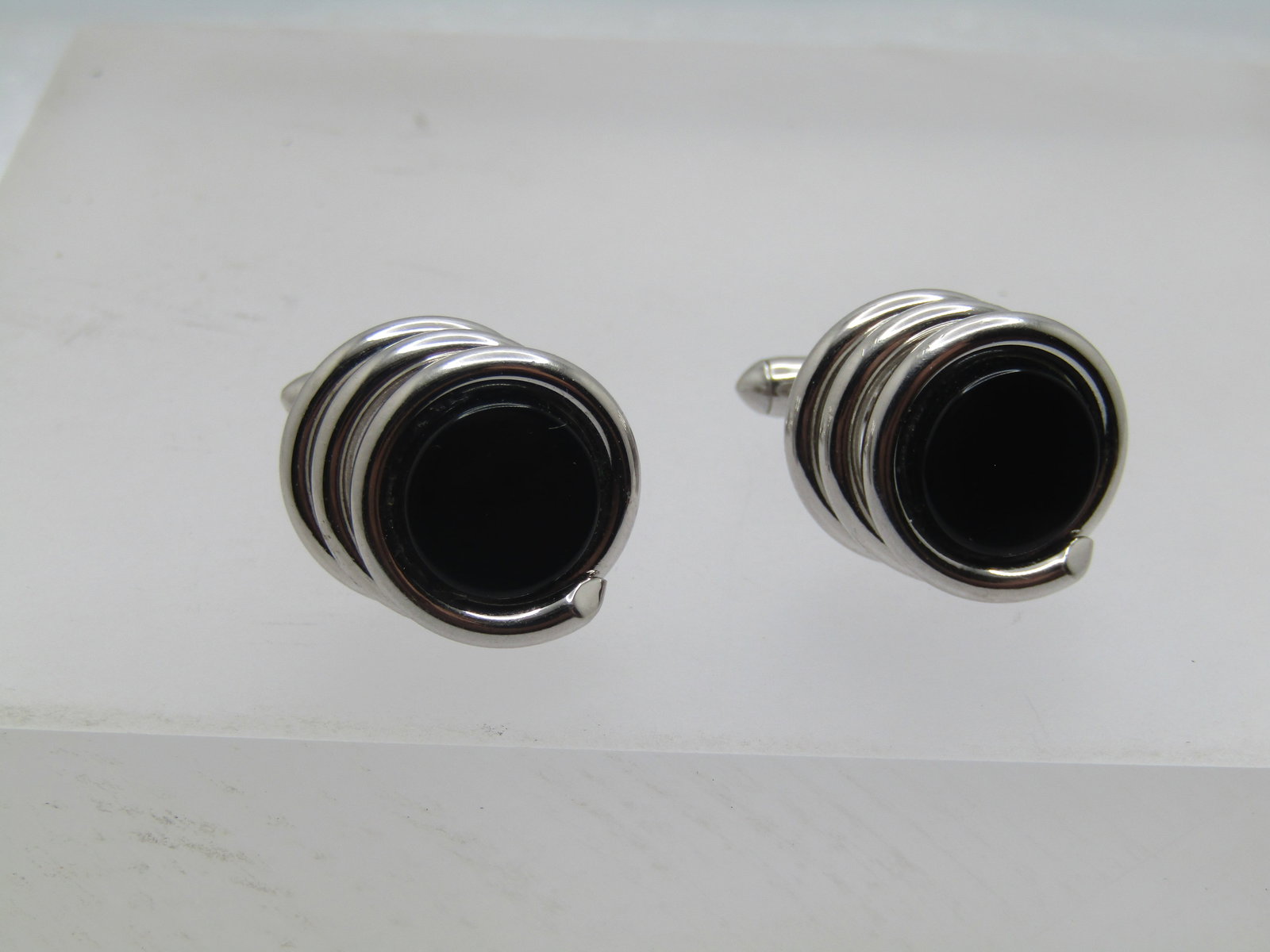 Vintage Black Glass Tiered Wrap Cufflinks, 1960's-1970's: Vintage Black Glass Tiered Wrap Cufflinks, 1960's-1970's. They are appx. 5/8" round on top - it is a black glass circular insert with a sivler tone wrap that has two more wraps under the stone and