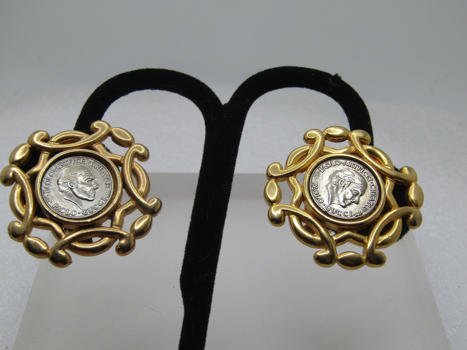 Vintage Paolo Guicci Medallion Coin Earrings, Clip, 1980's: Vintage Paolo Guicci Medallion Coin Earrings, Clip, 1980's. Silver tone coin in the center and a scrolling yellow gold tone frame, sturdy clips, they are appx. 1-3/8" across. Padded clips. Signed Paol
