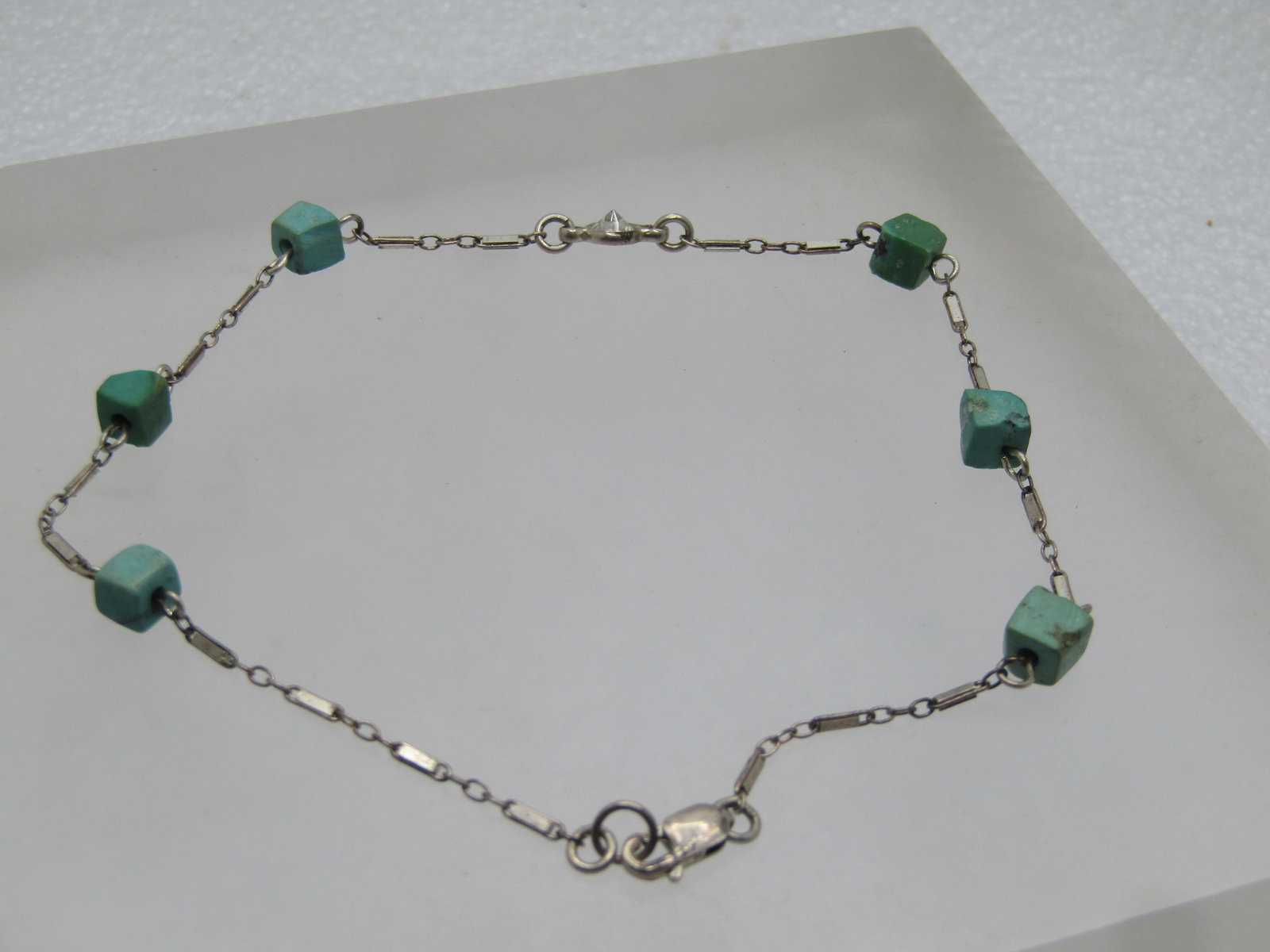 Vintage Sterling Turquoise Rhinestone Ankle Bracelet, 9.25", 1980's-1990's: Vintage Sterling Turquoise Rhinestone Ankle Bracelet, 9.25", 1980's-1990's. The chain is a 1mm bar link with conector links with six appx. 4mm square(ish) turquoise cube beads and a cincle clear