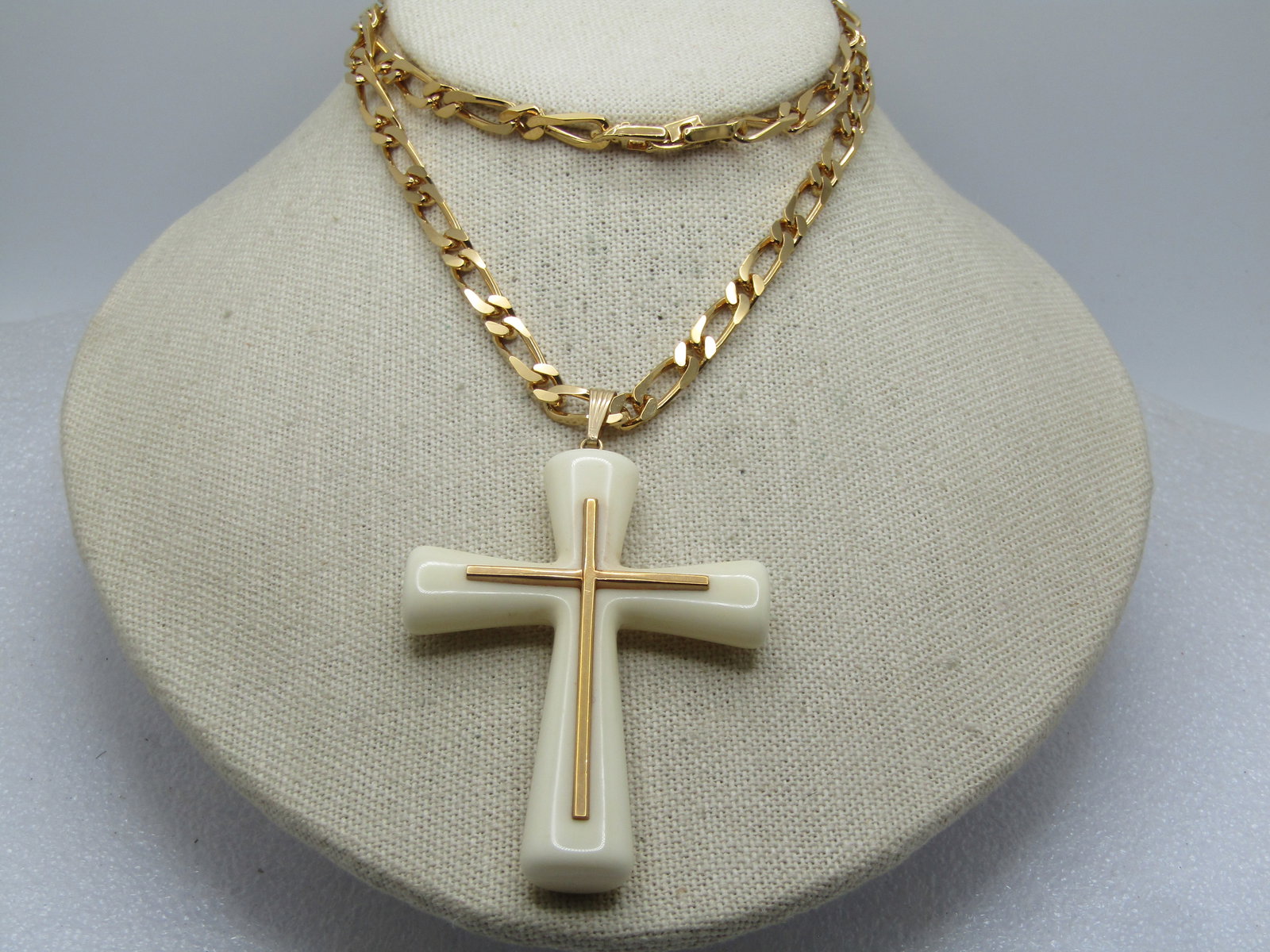 Vintage Monet White Reversible Cross Necklace, 24", 1960's-1970's: Vintage Monet White Reversible Cross Necklace, 24", 1960's-1970's. The cross is white acrylic and appx. 3.25" by 2" with one side all white and the other side has a raised gold tone cross that is 2" t