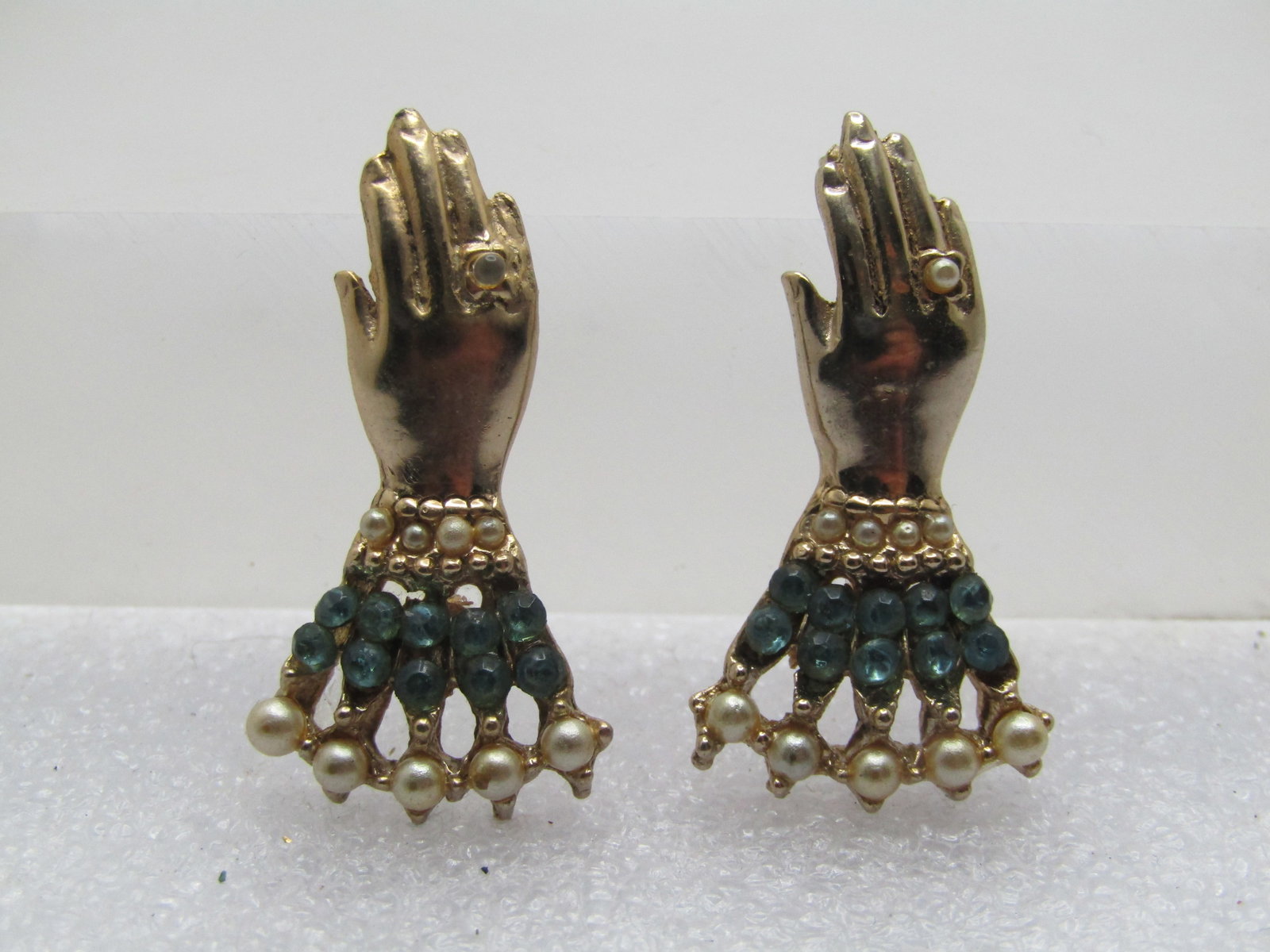 Vintage Pair Lady's Hand Brooches, Rhinestones & Faux Pearls, 1940's-1960's: Vintage Pair Lady's Hand Brooches, Rhinestones & Faux Pearls, 1940's-1960's. Gold tone lady hands scatter pins. Wearing a faux pearl ring with cuffs of faux pearls in two sizes and a double row of aqu