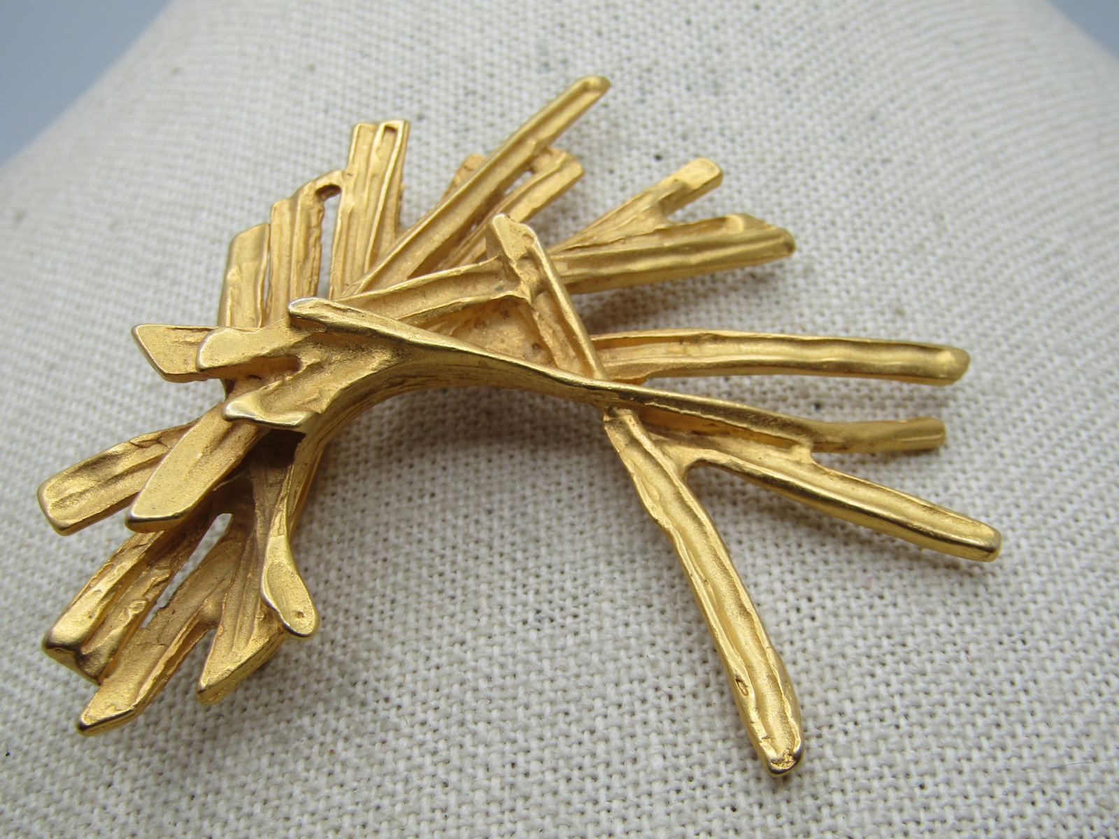 Vintage Gold Tone Mod Stacked Brooch, 1980's, 2.75": Vintage Gold Tone Mod Stacked Brooch, 1980's, 2.75" tall and wide in a satiny gold tone texturef finish like woodgrain on the back and recessed twig-like pieces on the front. It is not marked or signe
