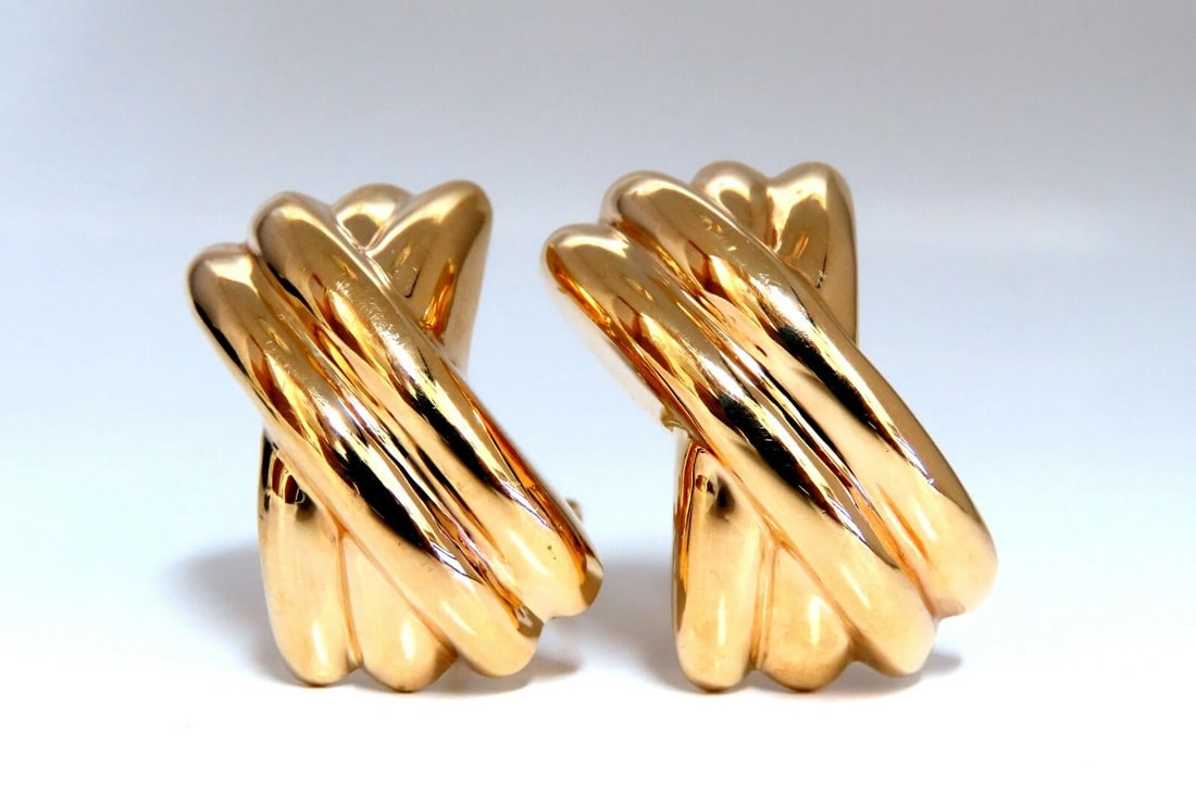 14kt Gold Raised X Clip Earrings Elongated**: Title: 14kt Gold Raised X Clip Earrings Elongated** Description: Smooth Classic X Clip Earrings Measurements of Earrings: 1.2 x .68 Inch Depth: .45inch Comfortable Omega Clips 9.5 grams / 14kt. Yellow