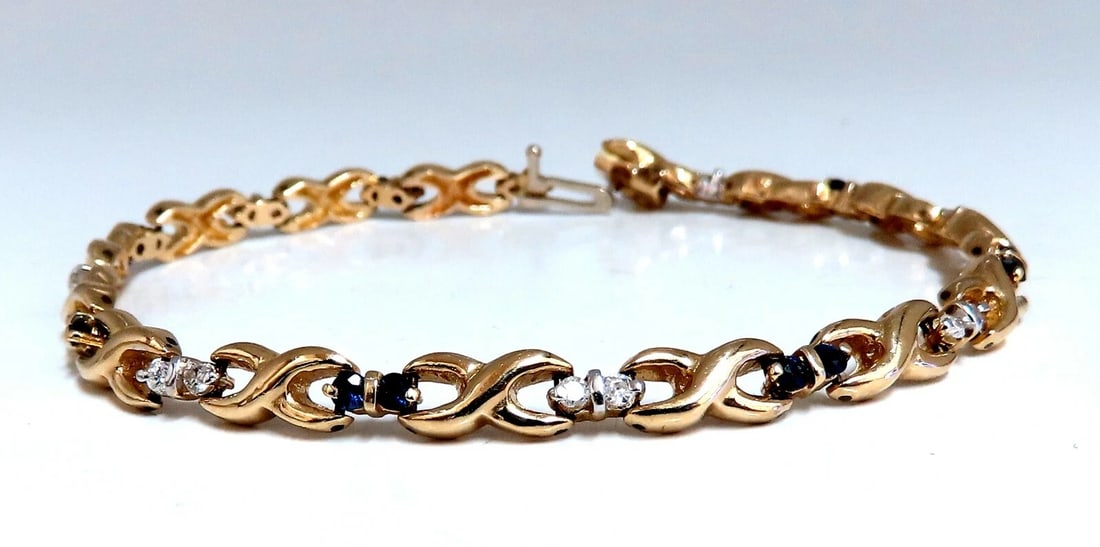 1.16ct Natural Sapphire Diamonds X Link Bracelet 14kt gold**: Title: 1.16ct Natural Sapphire Diamonds X Link Bracelet 14kt gold** Description: .80ct Natural Round Blue Sapphire Bracelet. 2mm average each. Diamonds: .36ct. H color, Vs-2 clarity. 14kt. yellow gold