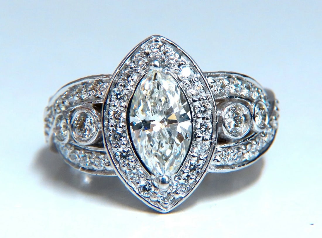 GIA Certified 1.01ct Natural Marquise Diamond Cluster Halo Ring 18kt**: Title: GIA Certified 1.01ct Natural Marquise Diamond Cluster Halo Ring 18kt** Description: Marquise Cluster Halo Prime GIA Certified 1.01ct. Marquise cut diamond ring. Report Id: 2195872544 H-color