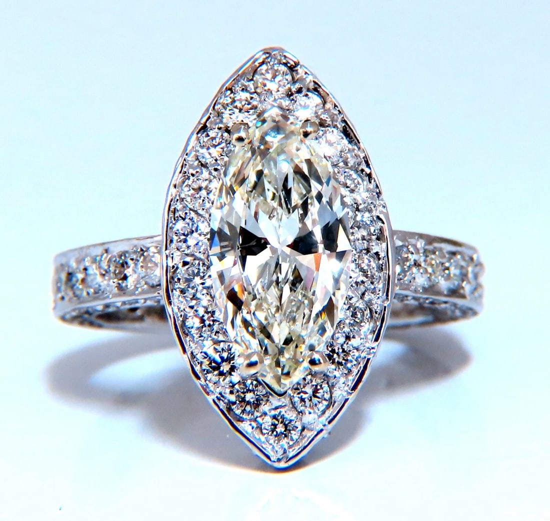 GIA Certified 2.03ct Natural Marquise Diamond Cluster Halo Ring 14kt**: Title: GIA Certified 2.03ct Natural Marquise Diamond Cluster Halo Ring 14kt** Description: Marquise Cluster Halo Prime GIA Certified 2.03ct. Marquise cut diamond ring. Report Id: 2215681760 K-color Si
