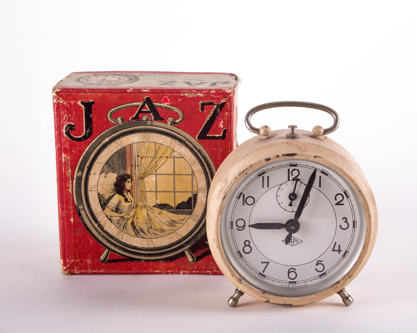 French Art Deco Art Deco alarm Clock JAZ with original box: French Art Deco white alarm clock , maker Jaz, not working condition , good for decorative purpose or to be refurbished with an electrical mecanism , include the original box D.4 x W. 2 1/4 Reserve: $