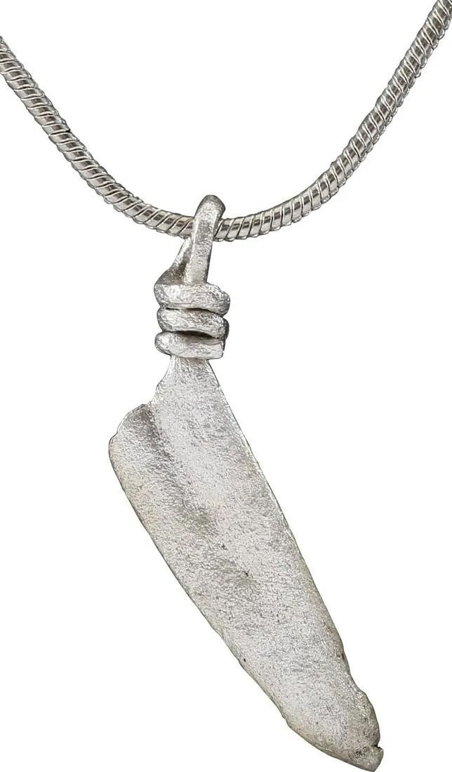 RARE ROMAN SACRIFICIAL KNIFE AMULET, 1st-2nd C.AD: Silvered bronze, slightly over 1" length, modeled after the knives used by Roman priests for the sacrifice of small animals in Pagan rituals. See British Museum #1873.8.20.31, for a related example