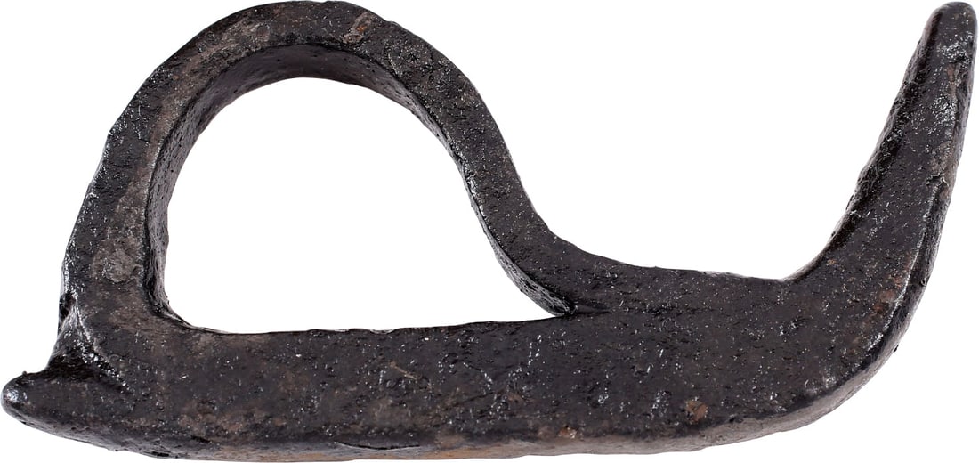 VIKING FLINT STRIKER, 9TH-10TH CENTURY AD: Elegant example of the Viking blacksmith's art with the striker bar terminating in a spike to engage a wood beam or tree and finger loop for maximum grip. The tail of the bar with a small nub, a
