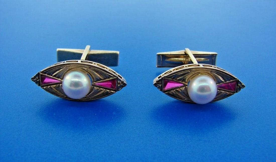 LUXURIOUS 14k Yellow Gold, Pearl & Ruby Cufflinks: Title: LUXURIOUS 14k Yellow Gold, Pearl & Ruby Cufflinks Description: DK 14k Yellow Gold, Ruby & Pearl Cufflinks · This is a must for any collector. · The weight is 10.6 grams. · The le