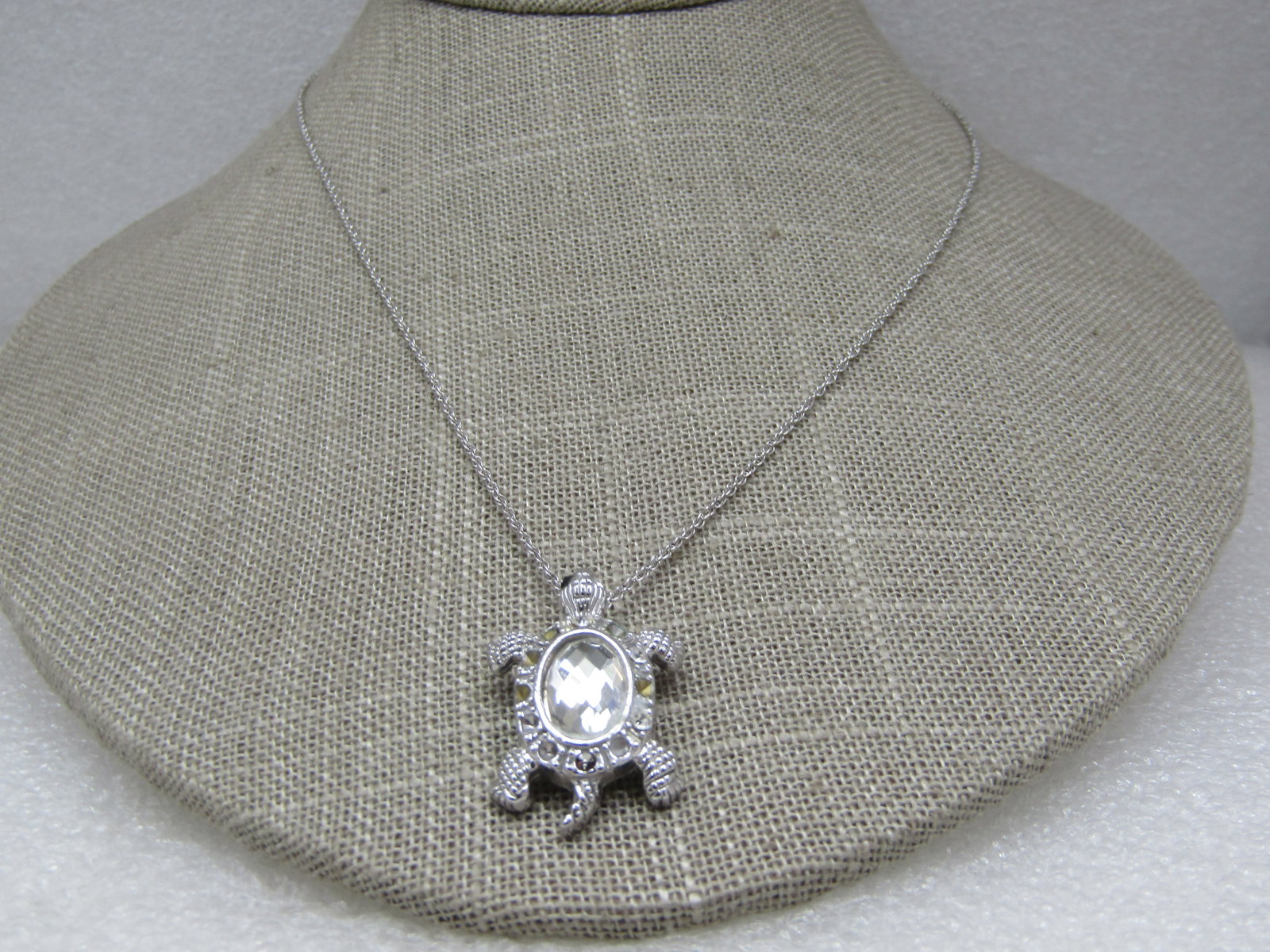 Sterling Rhinestone Turtle Necklacde, 18", Sri Lanka: Sterling Rhinestone Turtle Necklacde, 18", Sri Lanka. Marked .925 Sri Landa with a honeycomb faceted clar stone as the main shell and a halo of clear rhinestones. There were missing rhinestones as can