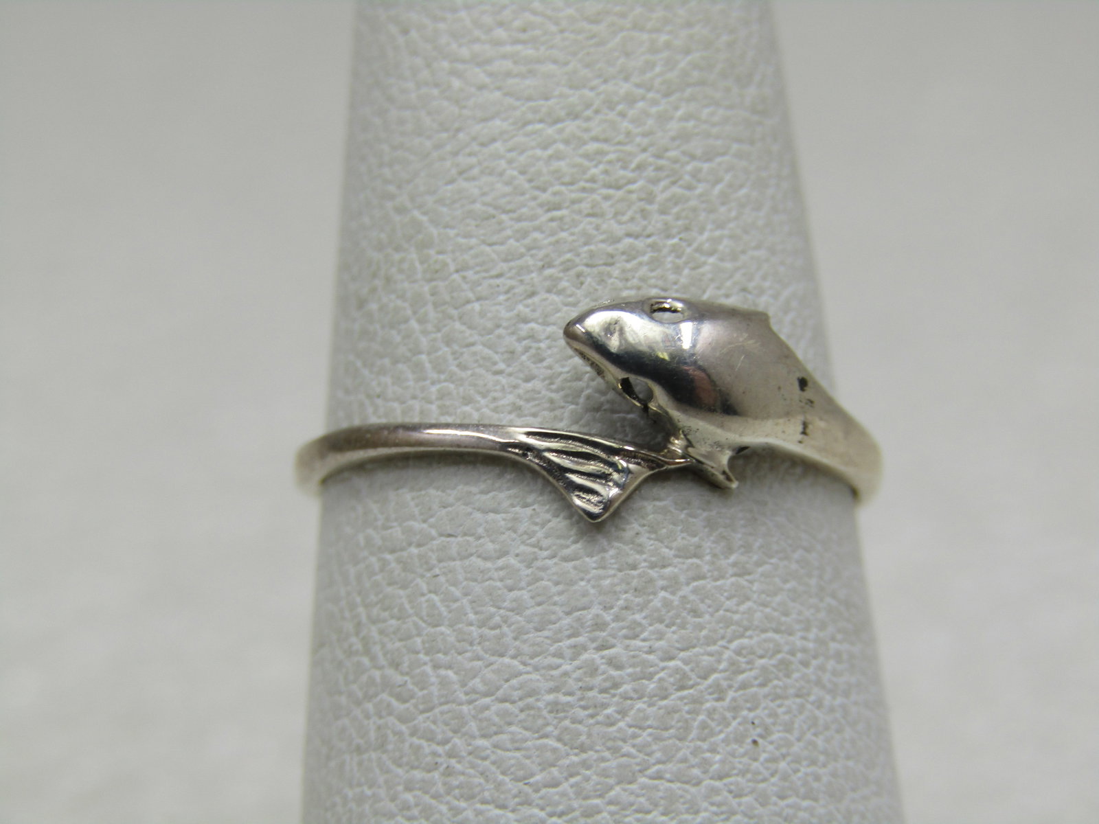 Vintage Sterling Dolphin Bypass Ring, Sz. 7: Vintage Sterling Dolphin Bypass Ring, Sz. 7. The dolphin has holes at the eyes, not just indents and the tail wraps around to the side of the head on top of the finger. The ring is 7mm at top and tape
