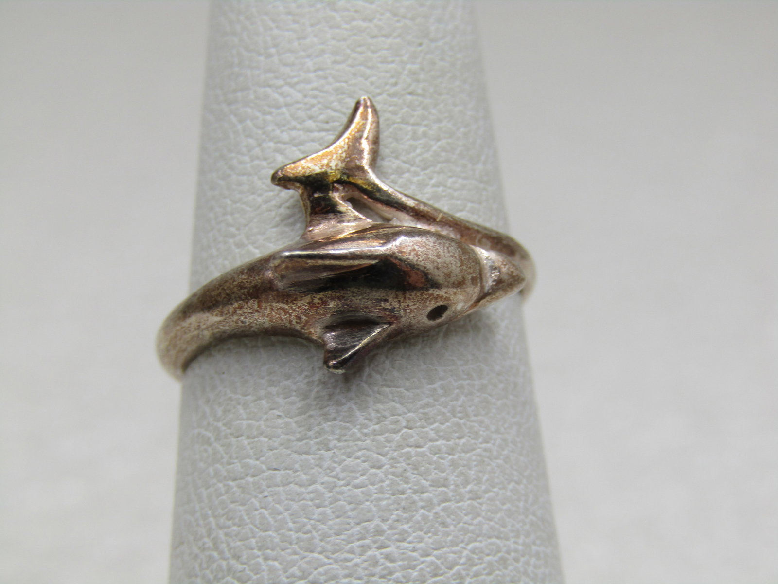 Sterling Silver Dolphin Bypass Ring, Sz. 6: Sterling Silver Dolphin Bypass Ring, Sz. 6 . Weight of the ring is appx. 1.79 gr. Dolphin with the tail that comes up from the other side of your finger and curves at the side of the dolphin's head. I
