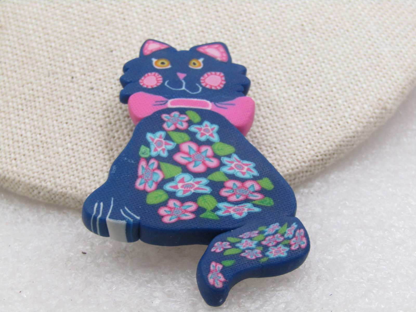Vintage Floral Cat Brooch, Dark Blue, Pink, Green, 2.25": Vintage Floral Cat Brooch, Dark Blue, Pink, Green, 2.25" by 1.5". This is made from a molded plastic with the design on both sides. It is not signed by the maker. Very good condition. Age is appx.