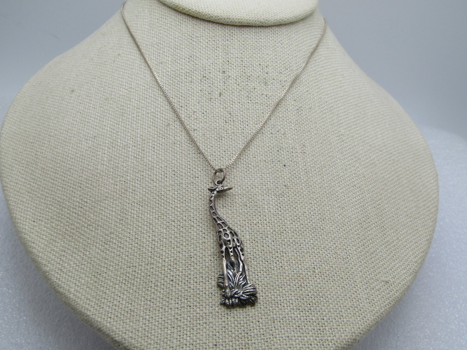 Vintage Sterling Tall Giraffe Necklace, 18"-22", 1970's-1980's, Signed: Vintage Sterling Tall Giraffe Necklace, 18"-20", Signed with a $ and copyright signed and marked sterling. Chain and pendant test as sterling with a weight of appx. 5.53 gr. The pendant is a tall