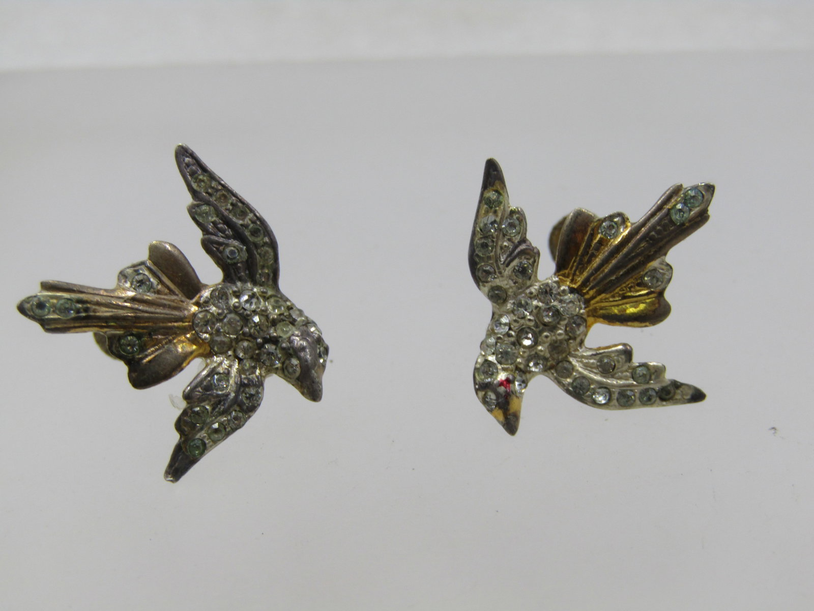 Vintage Sterling Vermeil Rhinestone Dove Earrings, Screwback, 1940's: Vintage Sterling Vermeil Rhinestone Dove Earrings, Screwback, 1940's. The upper havlf of the dve has pave set clear stones with a few decorating the lower half. The earrings are marked sterling on