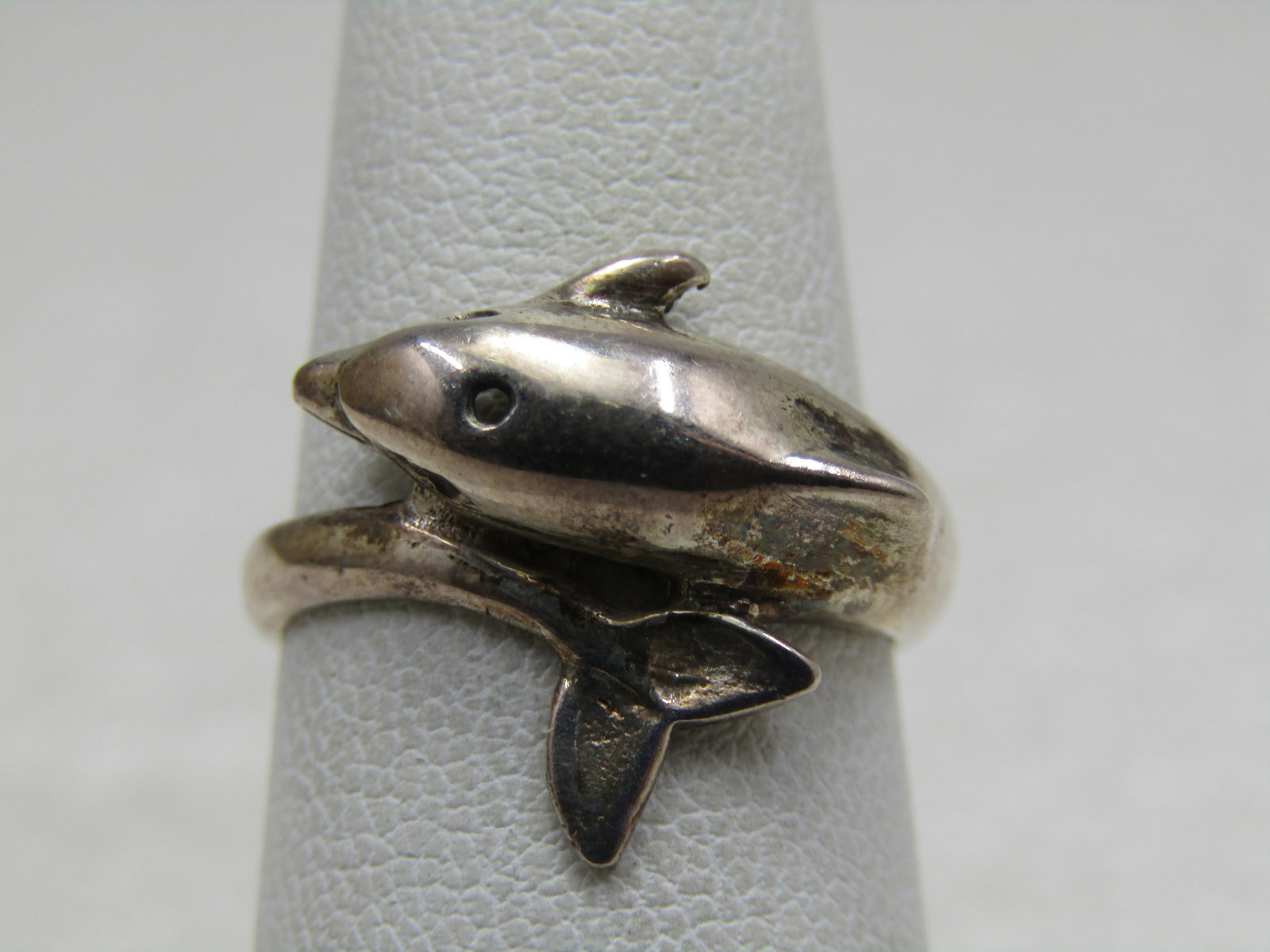 Vintage Sterling Dolphin Bypass Ring, Sz. 6.: Vintage Sterling Dolphin Bypass Ring, Sz. 6. The dolphin has holes at the eyes, not just indents and the tail wraps around to the side of the head on top of the finger. The ring is15mm at top and tape