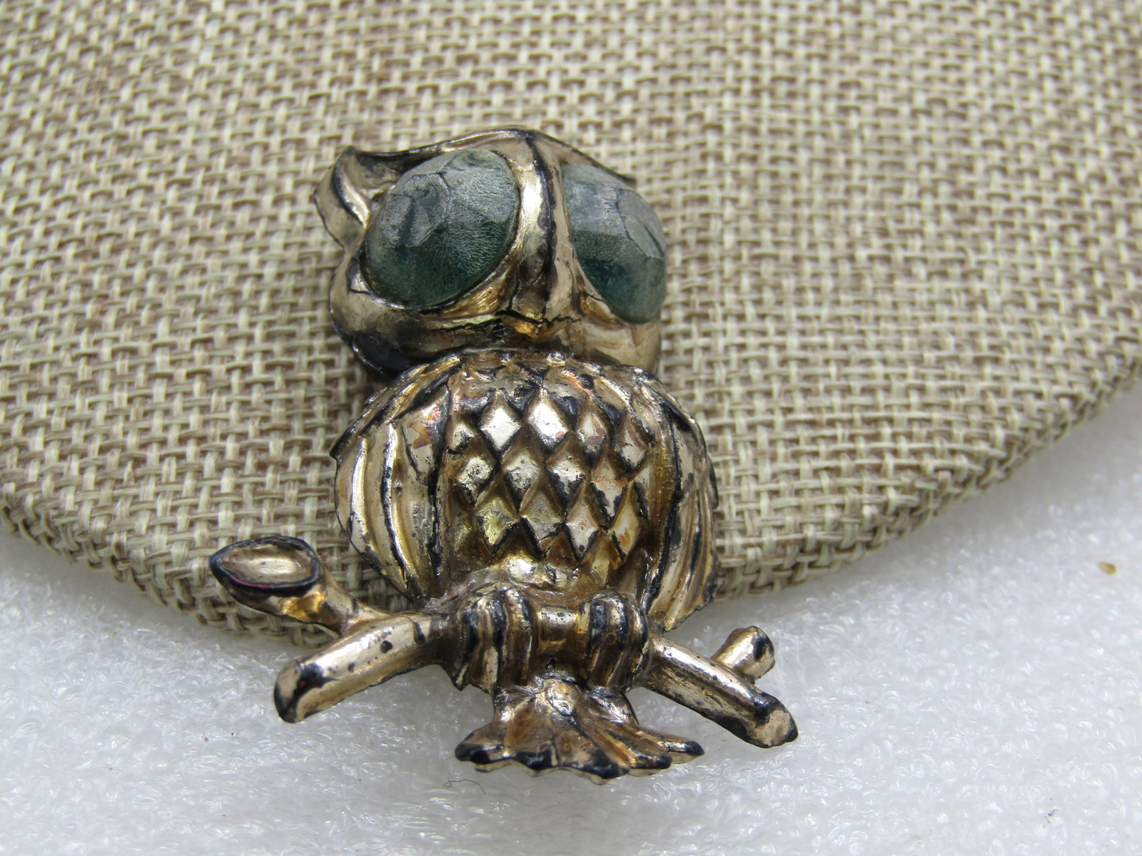 Vintage Silver Plastic Owl Brooch, 2": Vintage Silver Plastic Owl Brooch, 2" by 1.5". Age is appx. 1940's-1950's. Faceted eyes with a turquoise-ish color. This is a molder plastic with silver over and a square C-clasp. rustic look but