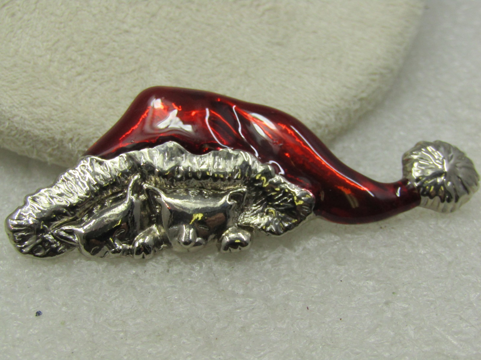 Vintage Red Enameled Cast Under Santa Hat Brooch, 1980's-1990's: Vintage Red Enameled Cats Under Santa Hat Brooch, 1980's-1990's. This is silver tone with a red enameled top of the hat. Under the cap are two sleeping cats under the fluffy brim. It is appx.