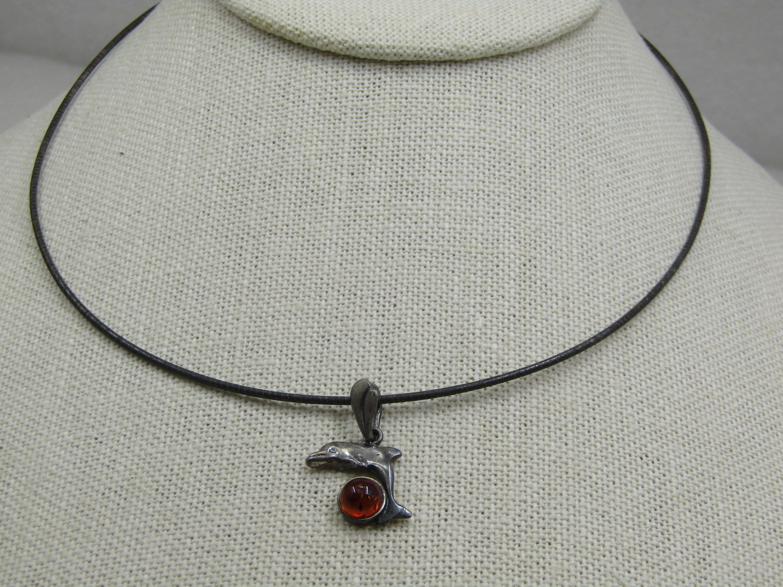 Vintage Sterling Amber Dolphin Necklace, Round Omega Necklace 16", 1980's: Vintage Sterling Amber Dolphin Necklace, Round Omega Necklace 16", 1980's.. The necklace is rounded and wire-like with an omegal type wrapped look and is appx. 1.2mm with lobster clasp. It is marked