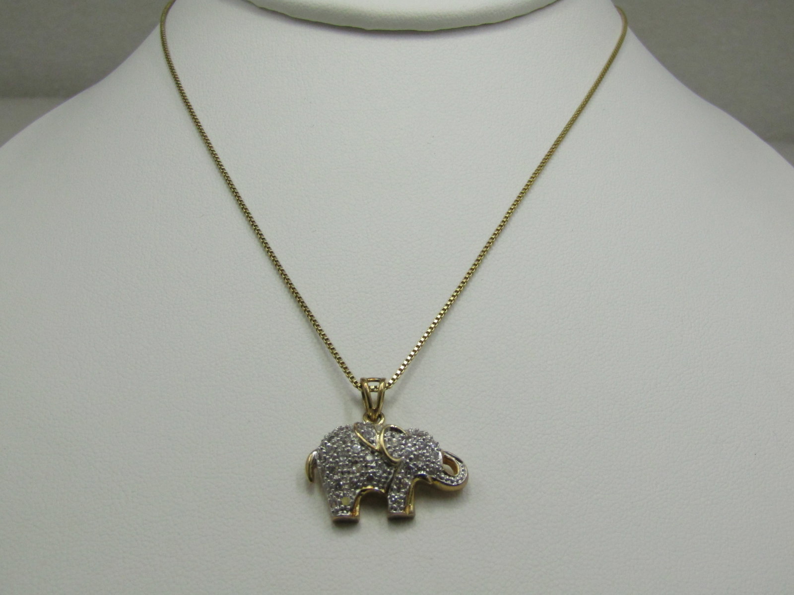 Vintage Gold Over Sterling CZ Elephant Necklace, Signed R, 18": Vintage Gold Over Sterling CZ Elephant Necklace, Signed R, 18". Two-tone 1" wide elephant that has pave-set CZ throughout the front of the elephant. Swing bail. The elephant is appx. 7/8" tall with