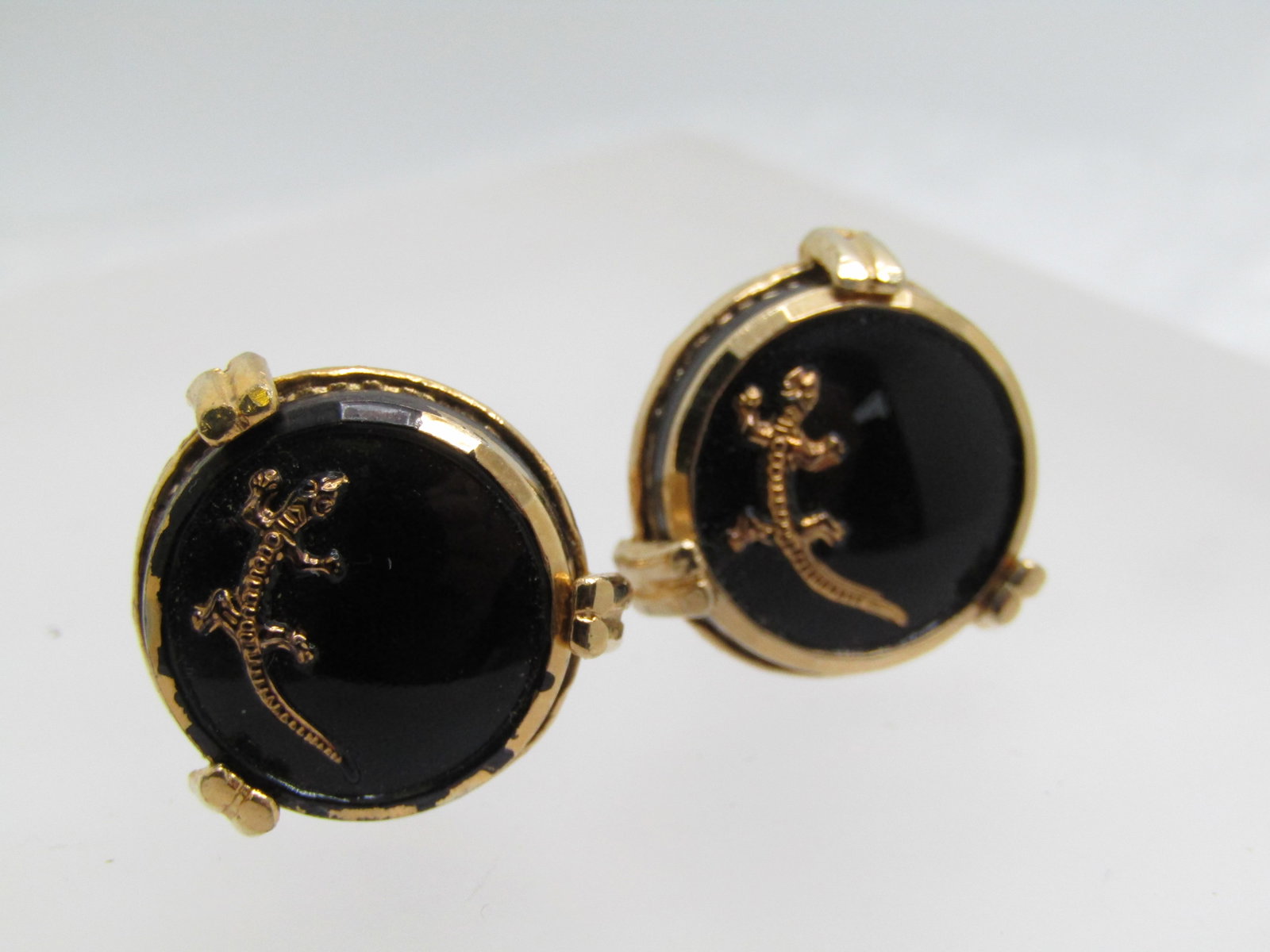 Vintage Black & Gold Gecko Cufflinks, 1960's-1970's: Vintage Black & Gold Gecko Cufflinks, 1960's-1970's. 3/4" round with a gold edge and gold tone setting. Some of the edge is worn but can be touched-up or fine as is - see photos. These are not