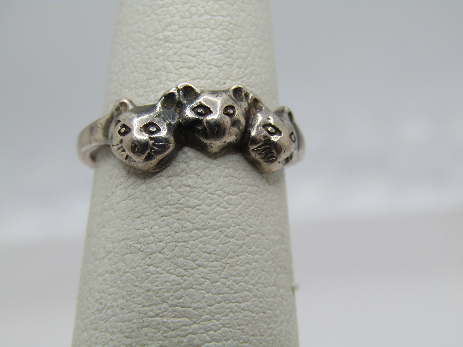 Vintage Triple Cat Ring, Sz. 4, 1970's-1980's, Signed: Vintage Triple Cat Ring, Sz. 4, 1970's-1980's, Signed with a $ maker's mark. It is marked sterling and tests as sterling with an appx. weight of 1.75 gr. It is appx. 6mm wide at the widest point. 