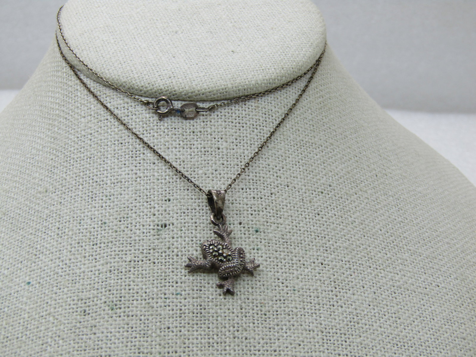 Vintage Sterling Marcasite Frog Necklace, 20", Signed CW: Vintage Sterling Marcasite Frog Necklace, 20", Signed CW, appx. 3.43 gr. The front is appx. 1" long and 1/2" wide. In the photo it was missing a marcasite but that has been replaced. Tapered swing