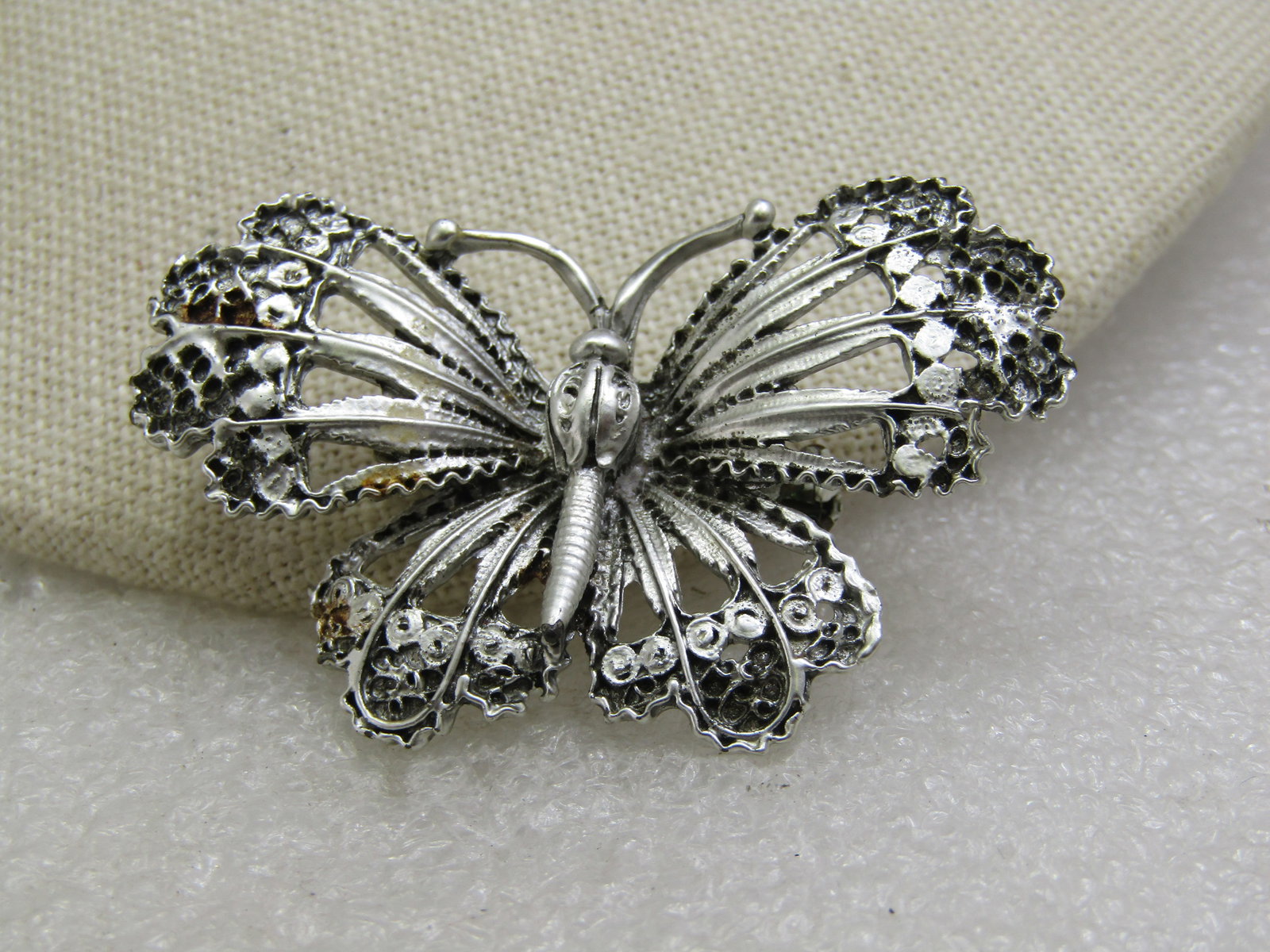 Vintage Silver Enameled Moth/Butterfly Brooch, 2": Vintage Silver Enameled Moth/Butterfly Brooch, 2" wide and 1.25" tall with open work in the winds and a lacy scalloped look on the tips Very good conidtion. Age is appx. 1950's-1960's. Not signed by t