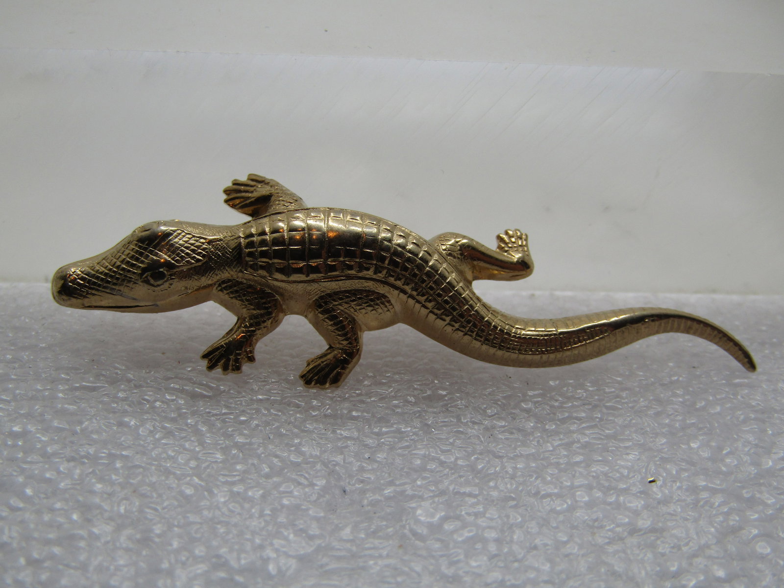 Vintage Alligator Brooch, 1960's-1970's, 2.5" long: Vintage Alligator Brooch, 1960's-1970's, 2.5" long and 7/8" wide. Pressed metal gold tone with locking clasp. Very clean and in very good condition. It is not signed by the maker. (W111123.5