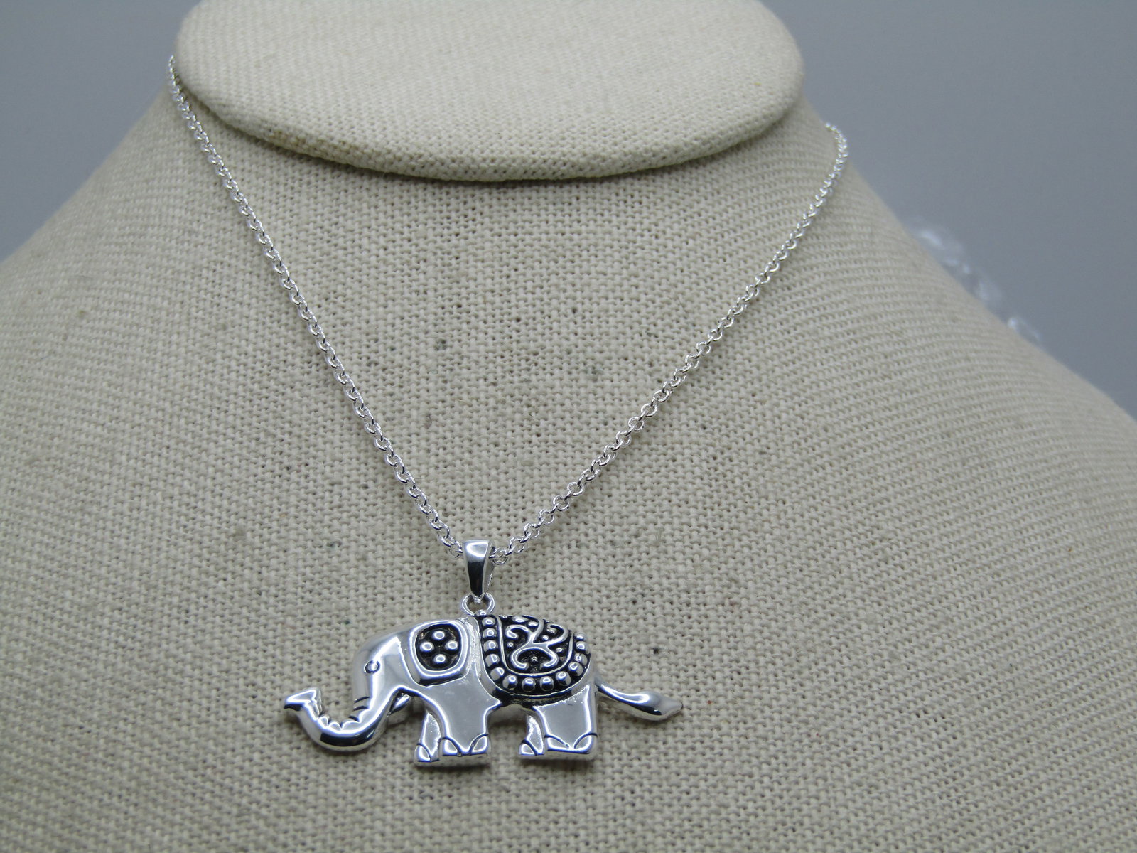 Silver Plated Enameled Elephant Necklace, 18" Signed Marsala: Silver Plated Enameled Elephant Necklace, 18" Signed Marsala. The elepehant pendant is appx. 1.5" wide and 1" tall with black enameling on the ear and his scrolled saddle. Signed with the MA (looks li